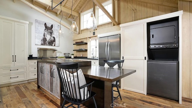 604 Begonia Ave, Corona Del Mar, CA 92625 - kitchen featuring stainless steel fridge, dark countertops, high vaulted ceiling, wood-type flooring, and a wood ceiling with exposed beams