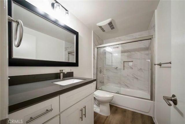 8190 Crowley Cir, Buena Park, CA 90621 - bathroom with vanity, wood finished floors, and bath / shower combo with glass door