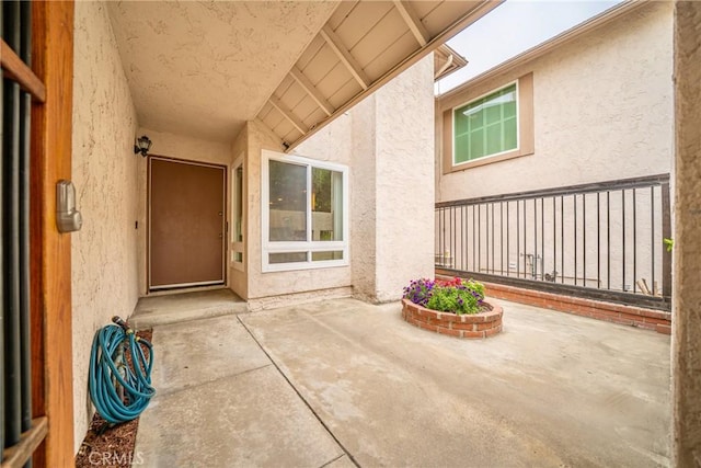 8190 Crowley Cir, Buena Park, CA 90621 - view of exterior entry with stucco siding and a patio