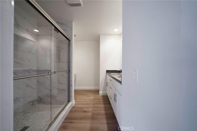 8190 Crowley Cir, Buena Park, CA 90621 - full bath with a marble finish shower, vanity, wood finished floors, and recessed lighting
