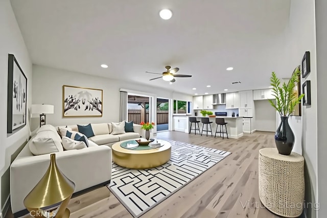 8190 Crowley Cir, Buena Park, CA 90621 - living area with light wood finished floors, recessed lighting, and ceiling fan