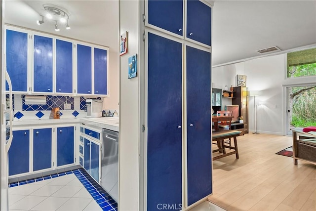 4900 E Chapman Ave Unit 102, Orange, CA 92869 - kitchen with stainless steel dishwasher, blue cabinetry, and light countertops