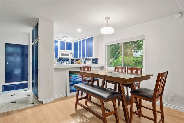 4900 E Chapman Ave Unit 102, Orange, CA 92869 - dining area with light wood-type flooring, baseboards, and recessed lighting