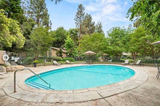 4900 E Chapman Ave Unit 102, Orange, CA 92869 - community pool with a patio and view of scattered trees