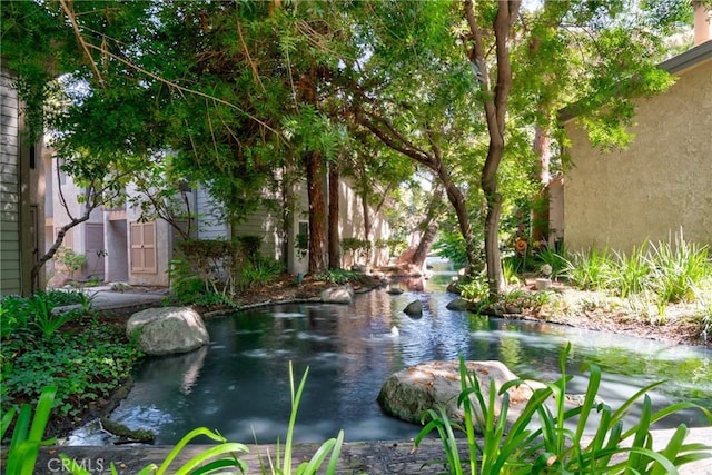 4900 E Chapman Ave Unit 102, Orange, CA 92869 - view of community with a small pond