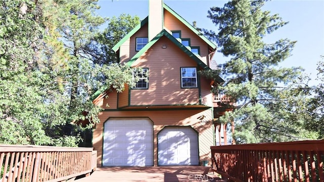 32455 Scandia Dr, Running Springs, CA 92382 - view of property exterior featuring a garage and concrete driveway