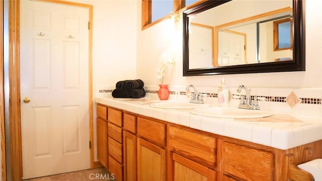 32455 Scandia Dr, Running Springs, CA 92382 - bathroom with double vanity, backsplash, and tile patterned floors