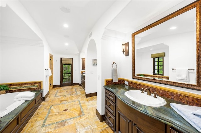 20 Cactus, Irvine, CA 92603 - bathroom with recessed lighting, vanity, baseboards, a garden tub, and marble tiled flooring
