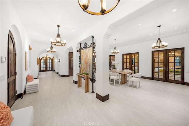 20 Cactus, Irvine, CA 92603 - corridor with a chandelier, french doors, arched walkways, baseboards, and recessed lighting
