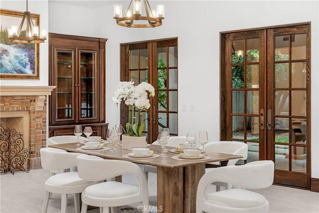 20 Cactus, Irvine, CA 92603 - dining area with a chandelier, french doors, and a brick fireplace