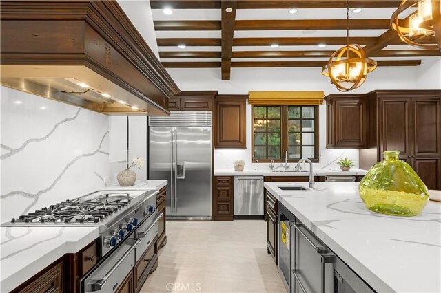 20 Cactus, Irvine, CA 92603 - kitchen featuring appliances with stainless steel finishes, premium range hood, beamed ceiling, pendant lighting, and a sink