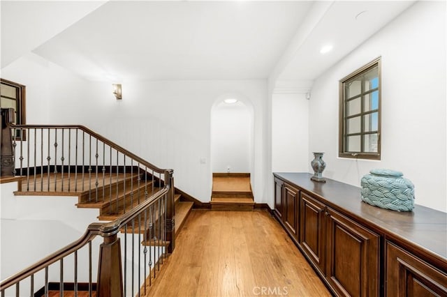 20 Cactus, Irvine, CA 92603 - hallway with light wood-style floors, arched walkways, stairs, baseboards, and recessed lighting