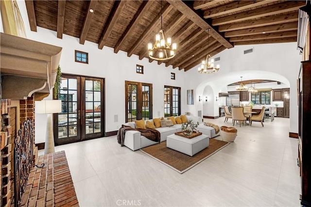 20 Cactus, Irvine, CA 92603 - living room featuring a chandelier, arched walkways, wood ceiling with exposed beams, french doors, and high vaulted ceiling