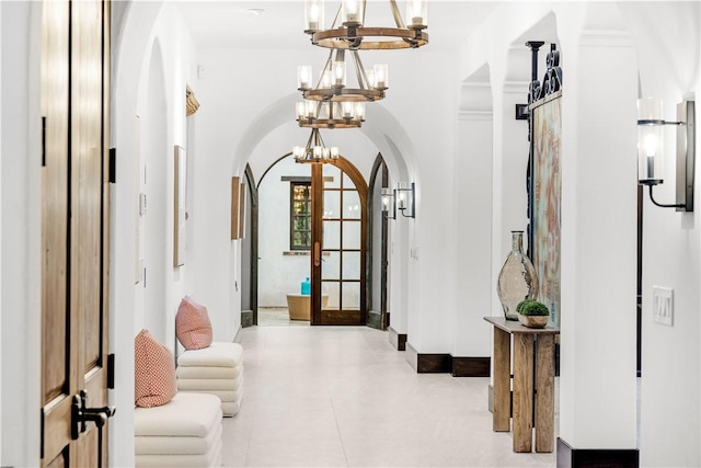 20 Cactus, Irvine, CA 92603 - hall with arched walkways, a chandelier, and french doors