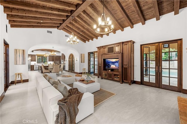20 Cactus, Irvine, CA 92603 - living area with a chandelier, arched walkways, french doors, wooden ceiling with exposed beams, and high vaulted ceiling
