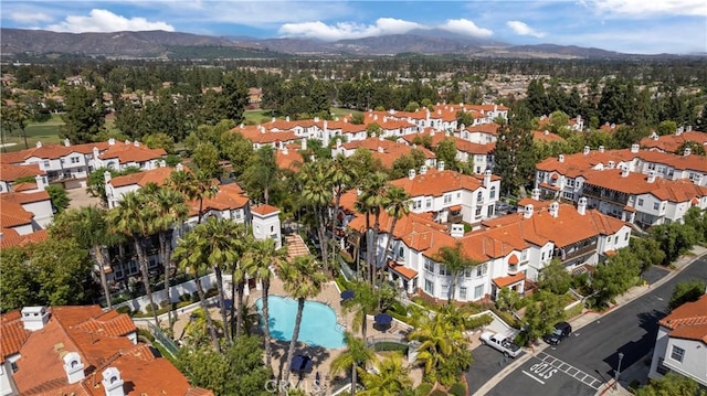 2911 Ballesteros Ln, Tustin, CA 92782 - drone / aerial view of a mountainous background and a pool