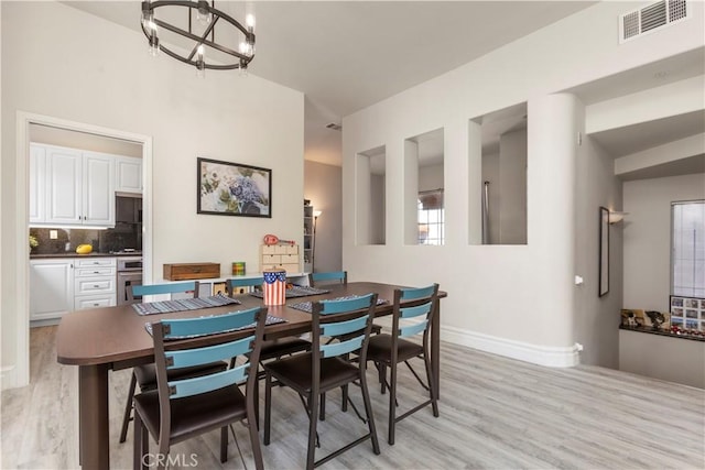 2911 Ballesteros Ln, Tustin, CA 92782 - dining room with a chandelier and light wood-type flooring