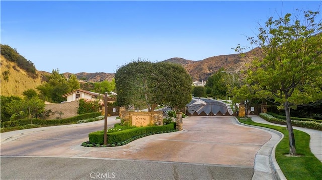 2514 Bulrush Cir, Corona, CA 92882 - surrounding community with a mountain view and curved driveway