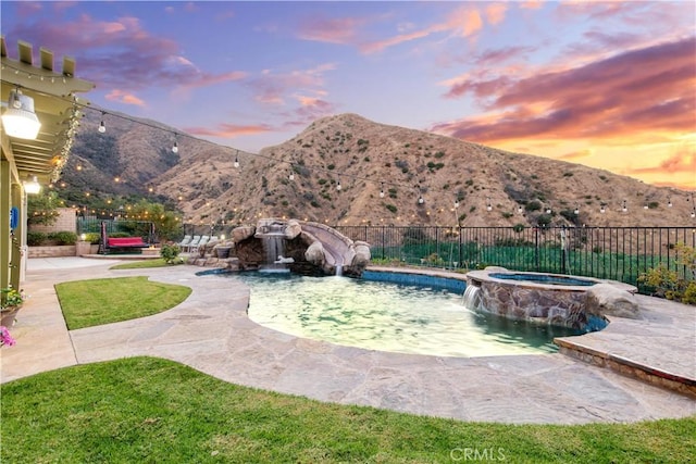2514 Bulrush Cir, Corona, CA 92882 - view of swimming pool featuring a mountain view, a patio area, and a pool with connected hot tub