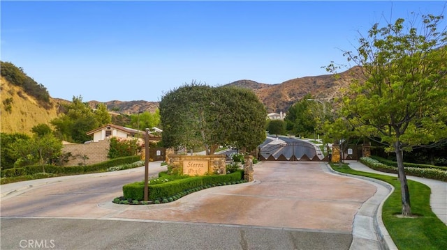 2514 Bulrush Cir, Corona, CA 92882 - surrounding community with a mountain view and curved driveway