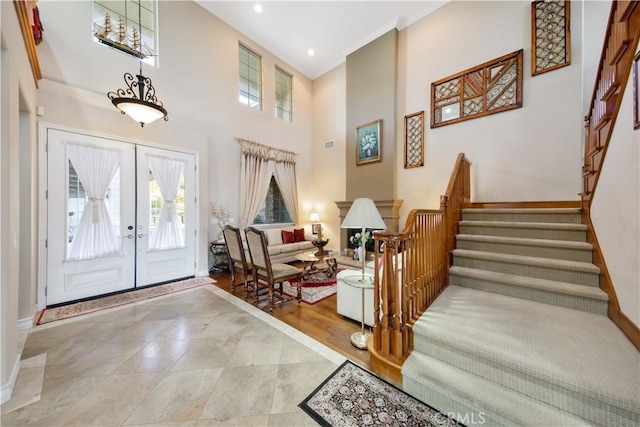 2514 Bulrush Cir, Corona, CA 92882 - entryway with stairs, baseboards, a towering ceiling, french doors, and ornamental molding