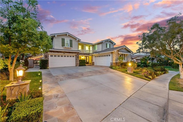 2514 Bulrush Cir, Corona, CA 92882 - traditional-style home featuring a garage, driveway, and stone siding
