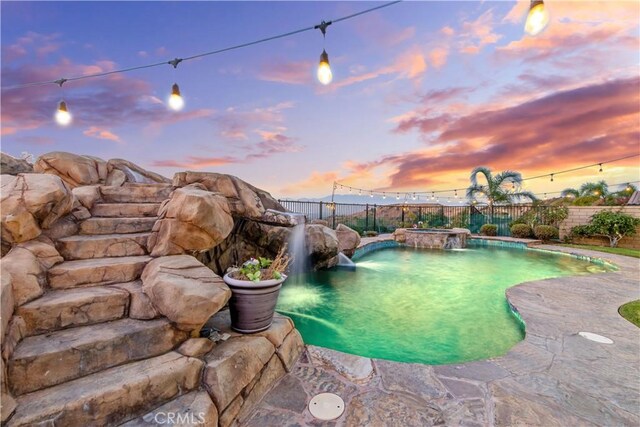 2514 Bulrush Cir, Corona, CA 92882 - pool at dusk featuring a fenced backyard