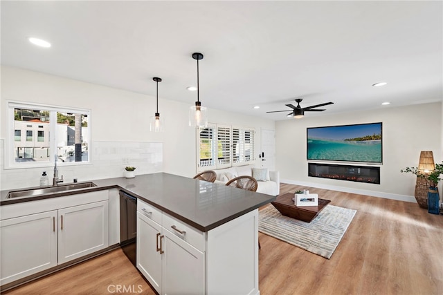 2175 S Coast Hwy Unit 16, Laguna Beach, CA 92651 - kitchen featuring a sink, dark countertops, a ceiling fan, light wood-style floors, and recessed lighting