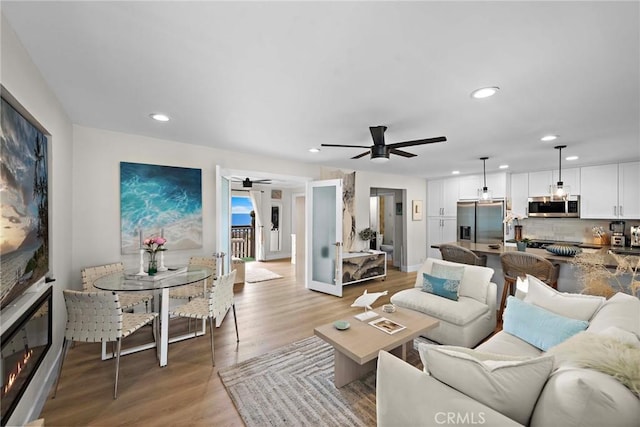 2175 S Coast Hwy Unit 16, Laguna Beach, CA 92651 - living area featuring ceiling fan, light wood-style floors, recessed lighting, and a glass covered fireplace