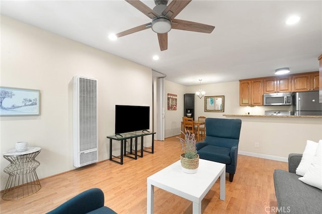 4727 W 147th St Unit 225, Lawndale, CA 90260 - living area featuring a heating unit, light wood-type flooring, a ceiling fan, and recessed lighting