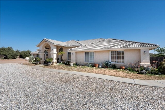 9098 Rattlesnake Rd, Phelan, CA 92371 - view of front of house with stucco siding and a tile roof