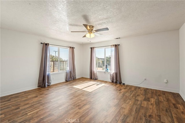 9098 Rattlesnake Rd, Phelan, CA 92371 - spare room featuring healthy amount of natural light, wood finished floors, a textured ceiling, ceiling fan, and baseboards