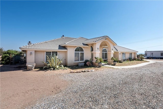 9098 Rattlesnake Rd, Phelan, CA 92371 - view of front of home featuring a chimney, a tile roof, and stucco siding
