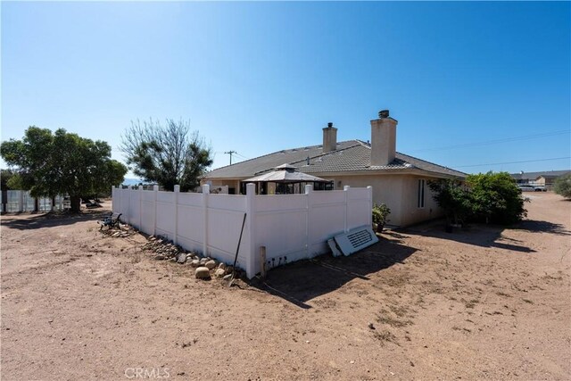 9098 Rattlesnake Rd, Phelan, CA 92371 - rear view of house featuring a chimney, a gazebo, and a tiled roof