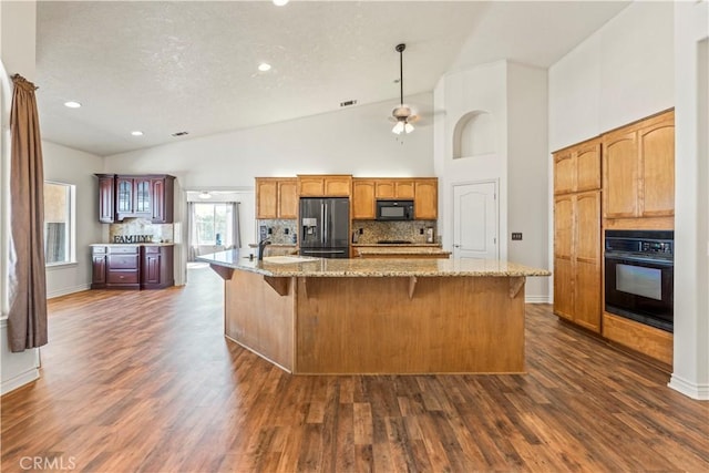 9098 Rattlesnake Rd, Phelan, CA 92371 - kitchen featuring black appliances, tasteful backsplash, dark wood-style floors, recessed lighting, and a textured ceiling