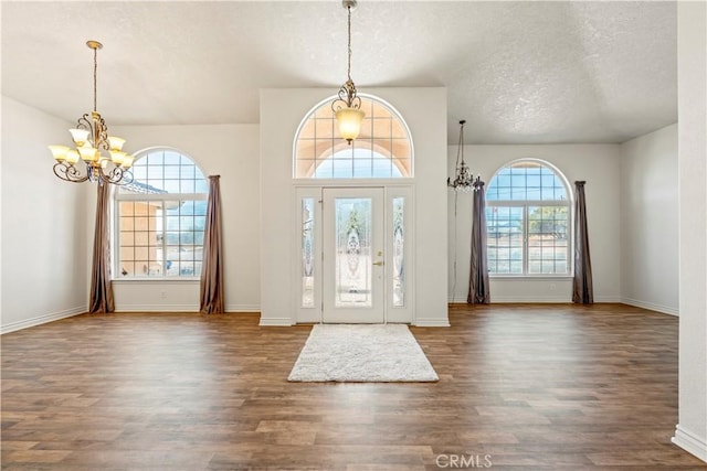 9098 Rattlesnake Rd, Phelan, CA 92371 - foyer featuring a chandelier, wood finished floors, a textured ceiling, and baseboards
