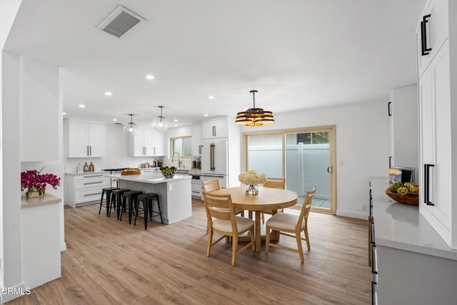 4834 Island View St, Oxnard, CA 93035 - dining area featuring light wood finished floors, recessed lighting, and a chandelier