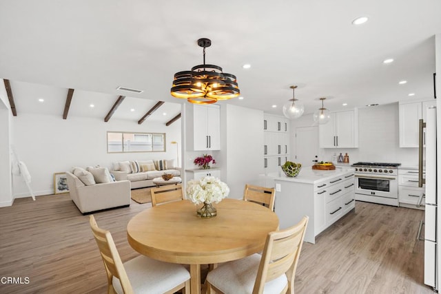 4834 Island View St, Oxnard, CA 93035 - dining room featuring recessed lighting, beam ceiling, light wood-type flooring, and a chandelier