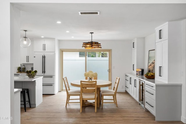 4834 Island View St, Oxnard, CA 93035 - dining space with recessed lighting, light wood-style flooring, a chandelier, and wine cooler