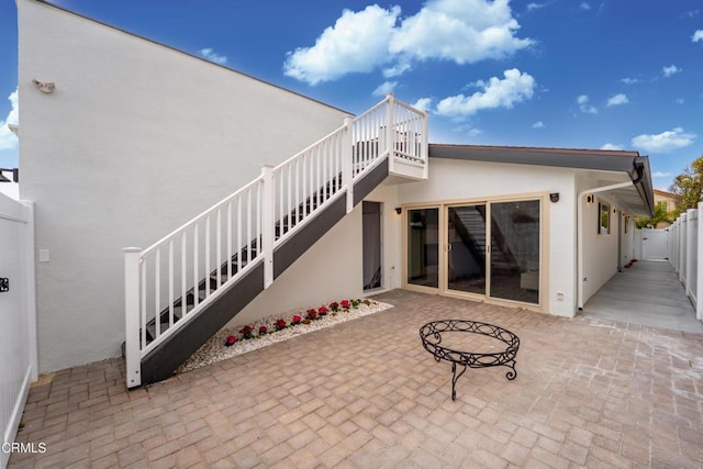 4834 Island View St, Oxnard, CA 93035 - back of property with stucco siding, stairs, and a patio