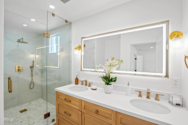 4834 Island View St, Oxnard, CA 93035 - bathroom featuring a marble finish shower, double vanity, and recessed lighting