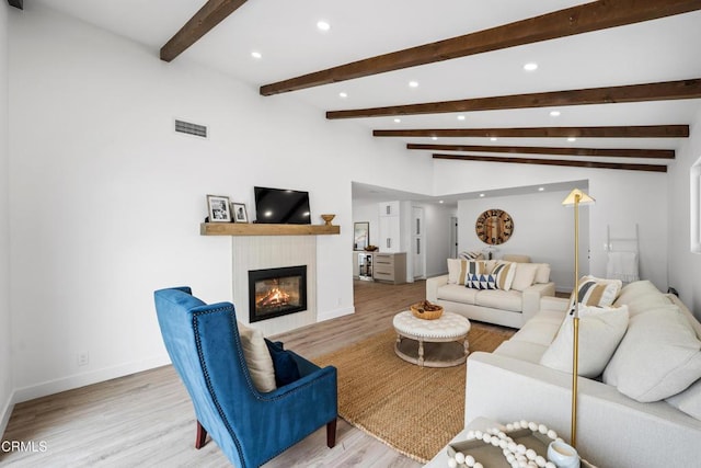 4834 Island View St, Oxnard, CA 93035 - living room featuring recessed lighting, wood finished floors, and a glass covered fireplace