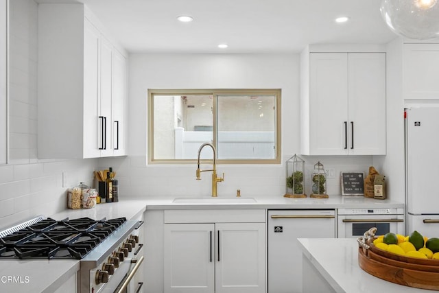 4834 Island View St, Oxnard, CA 93035 - kitchen featuring white appliances, white cabinetry, backsplash, light countertops, and recessed lighting
