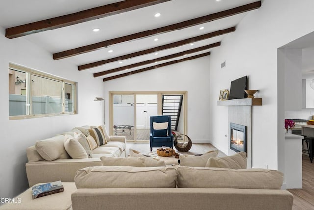 4834 Island View St, Oxnard, CA 93035 - living area with light wood-style flooring, recessed lighting, a glass covered fireplace, and beam ceiling
