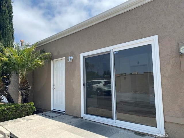 44516 La Paz Rd, Temecula, CA 92592 - property entrance with stucco siding and a patio area
