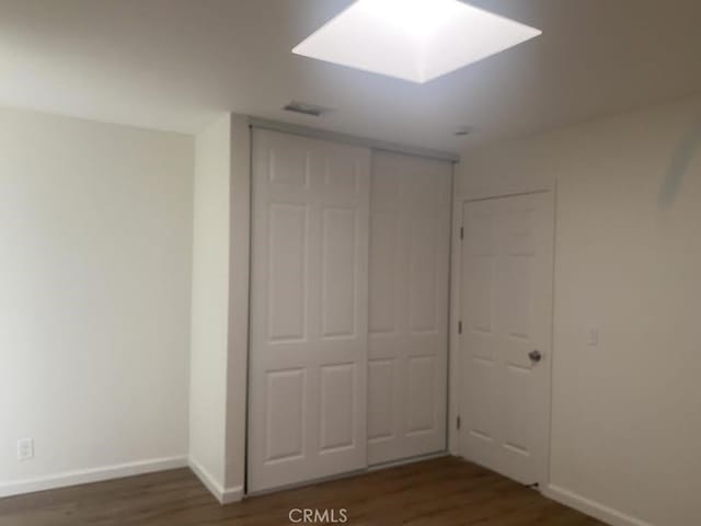 44516 La Paz Rd, Temecula, CA 92592 - unfurnished bedroom with wood finished floors and a closet
