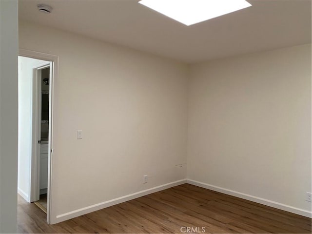 44516 La Paz Rd, Temecula, CA 92592 - spare room with a smoke detector and wood finished floors