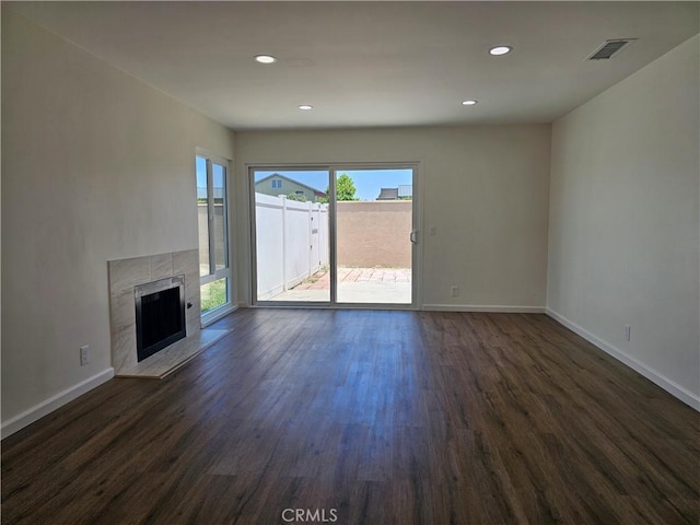 44516 La Paz Rd, Temecula, CA 92592 - unfurnished living room with dark wood-style floors, a fireplace, and recessed lighting