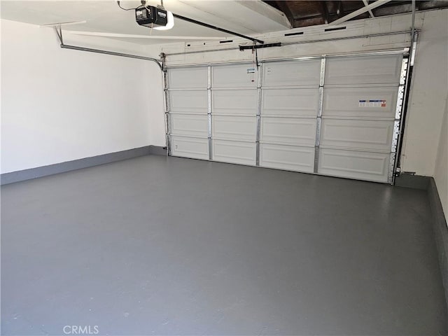 44516 La Paz Rd, Temecula, CA 92592 - garage featuring a garage door opener and baseboards