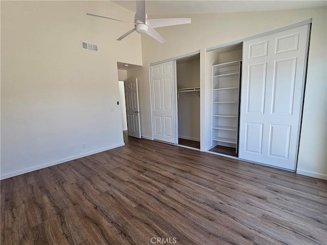 44516 La Paz Rd, Temecula, CA 92592 - unfurnished bedroom featuring dark wood-style floors, multiple closets, high vaulted ceiling, and ceiling fan